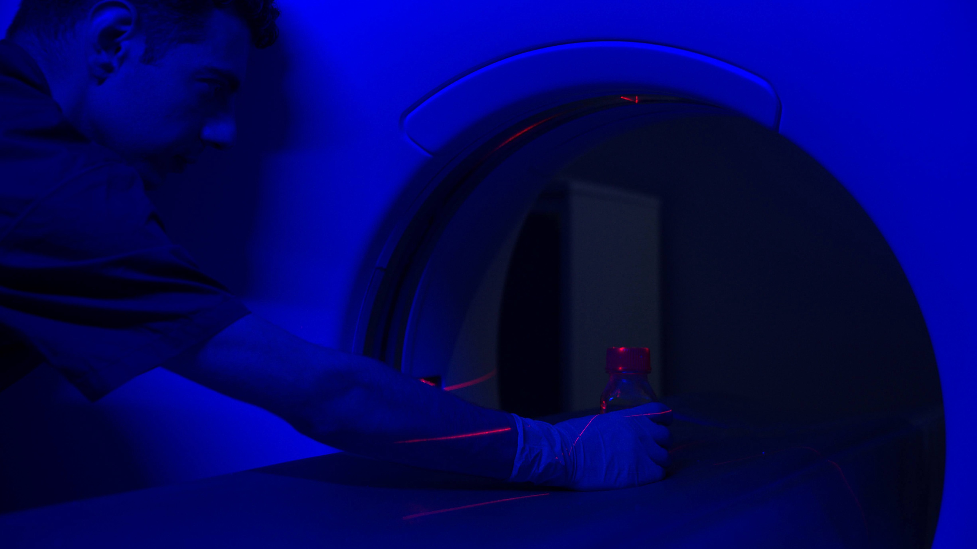 Researcher working beside cryopreservation laboratory equipment